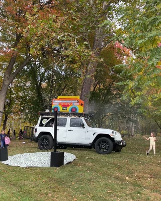 BoomBoxCar daytime setup beneath autumn trees