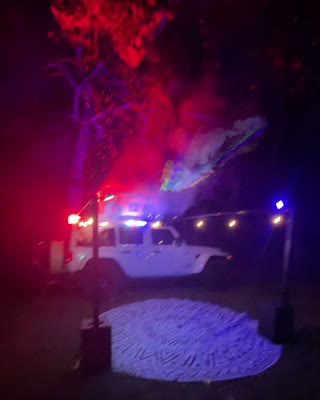 BoomBoxCar surrounded by red and blue event lighting