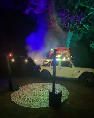 Purple and green lighting across the BoomBoxCar party space